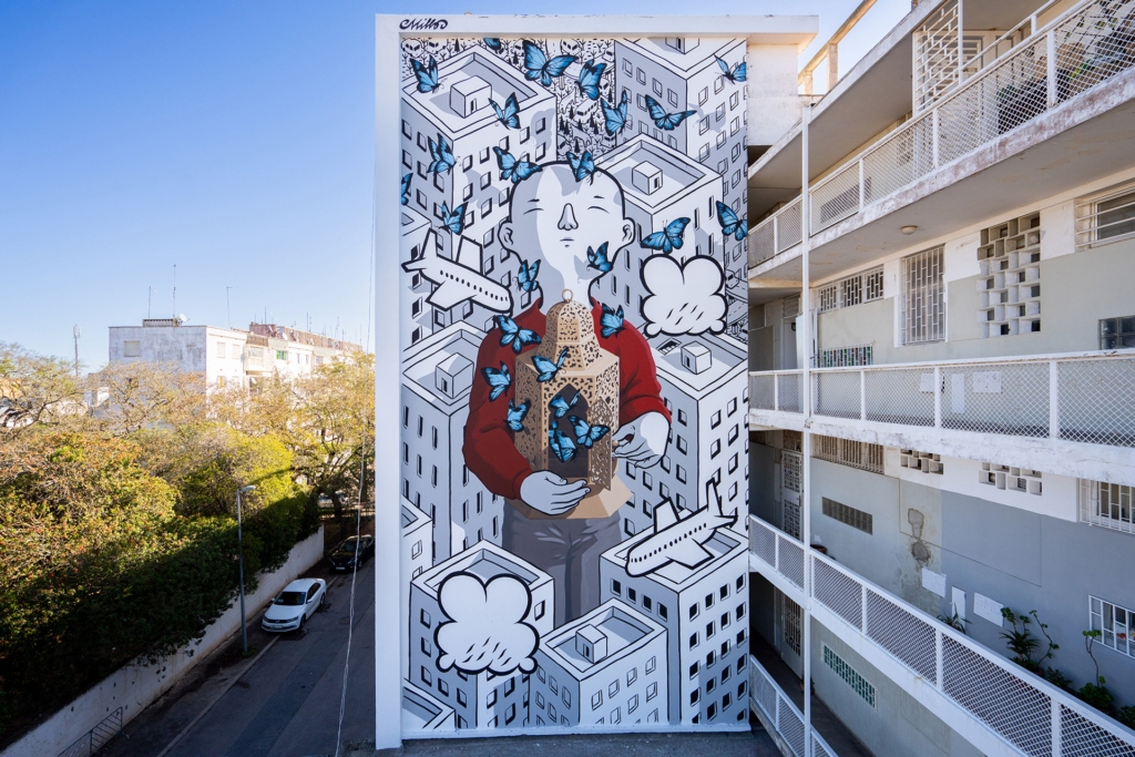 Millo, de son vrai nom Francesco Camillo Giorgino, est un artiste italien connu pour ses fresques monumentales en noir et blanc...